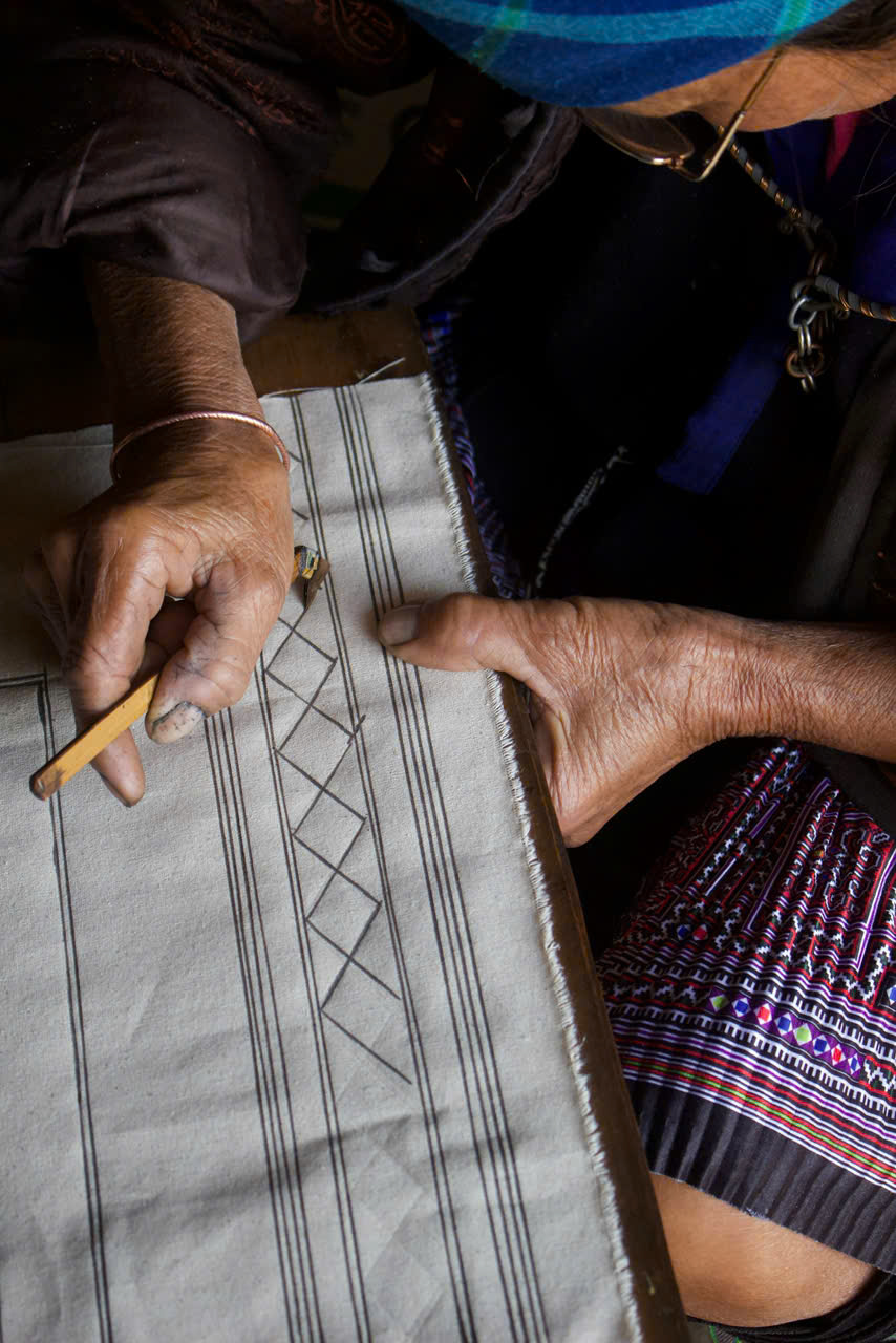 Hmong artisan weaving traditional fabric