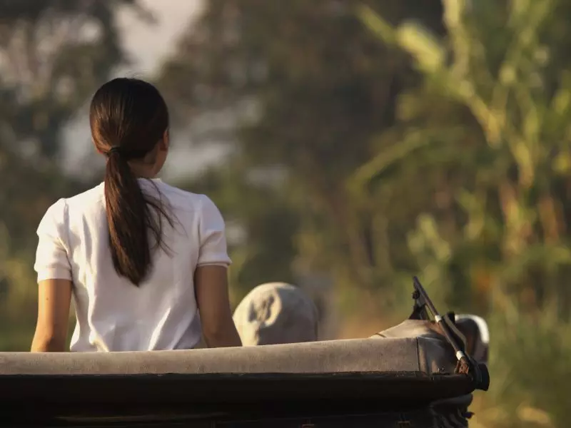 Woman relaxing by the paddy fields