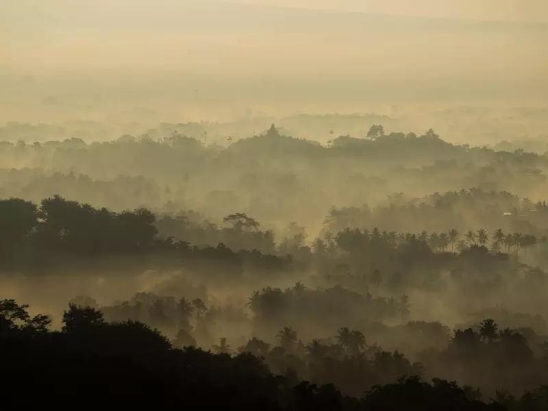 Borobudur temple amidst the nature and cloud during the dusk