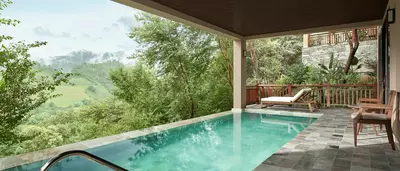 Private pool of the Garrya Two-Bedroom Pool Suite overlooking mountains and rice terraces.