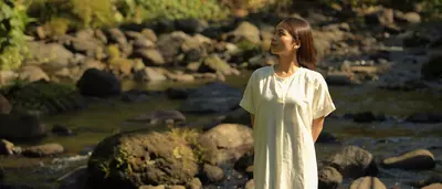 a woman in the middle of the nature