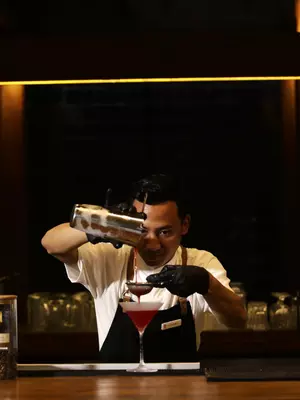 Barternder is crafting a cocktail