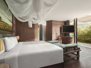 Hmong Garden View Pool Suite bedroom with mountain and rice terrace view from the terrace.