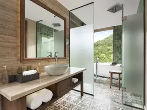 Grand Deluxe Room King bathroom with relaxing bathtub and modern design.