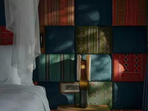 Room interior featuring handcrafted ethnic textiles and tranquil mountain-inspired design at Garrya Mu Cang Chai.